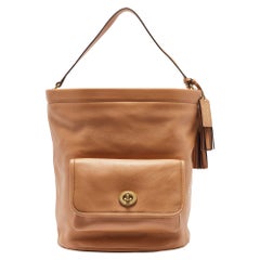Coach Beige Leather Legacy Tassel Bucket Bag
