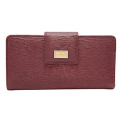Dolce & Gabbana Burgunderfarbenes kontinentales Portemonnaie aus Leder mit Klappe