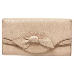 Burberry Cartera Continental de Piel Beige con Lazo