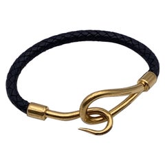Hermès Jumbo-Hakenarmband aus schwarzem gewebtem Leder in Gold und Metall