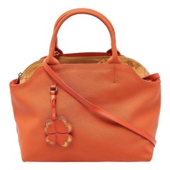 Alviero Martini 1A Classe Cartera de lona revestida con estampado geométrico naranja/marrón