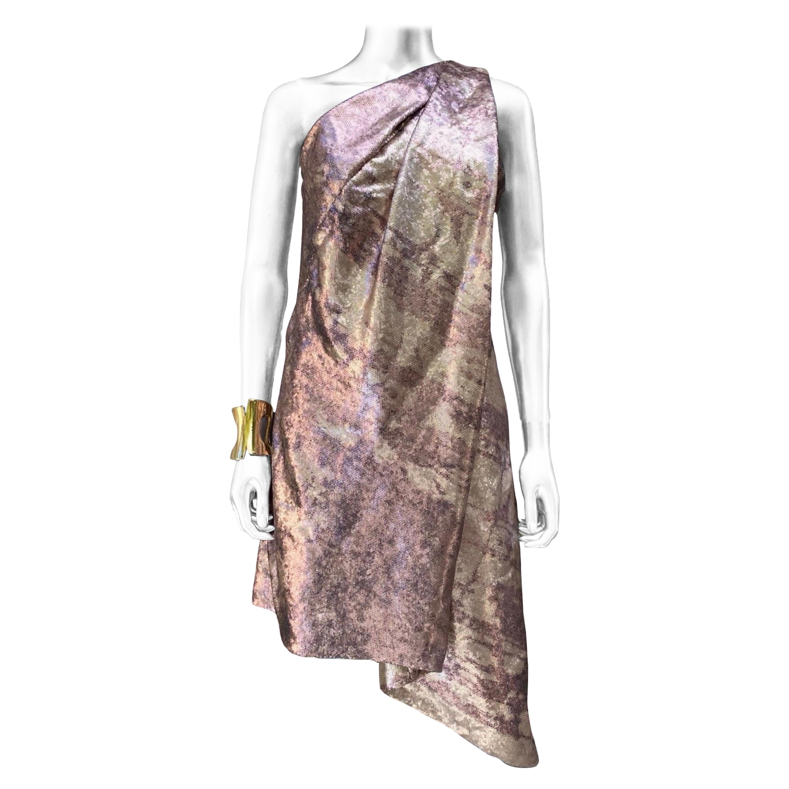 Chic is the only way to describe this dress. Designed by design duo legends KaufmanFranco, the fabric is entirely covered in sequence in a modern art ombré coloration that looks like watercolor brushstrokes. The one shoulder, asymmetrical hem on