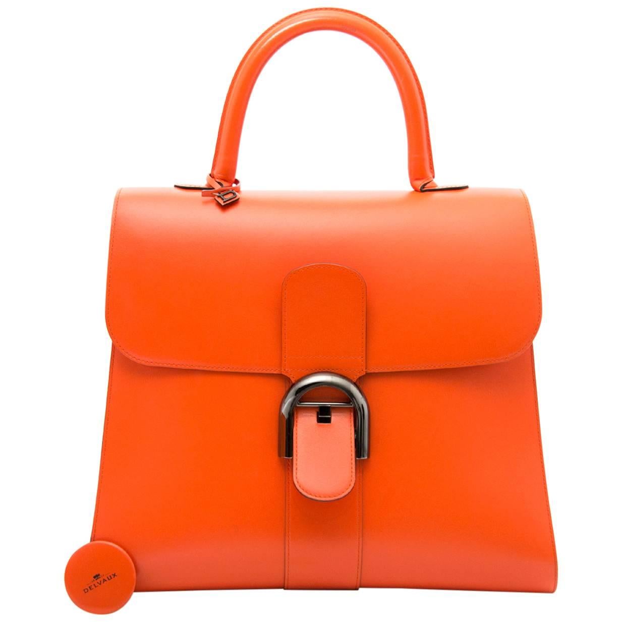 Delvaux Brillant Black Edition in mandarine