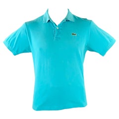 Polo LACOSTE bleu turquoise en coton avec logo patch