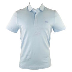 Polo LACOSTE taille S avec broderie bleue en coton mélangé