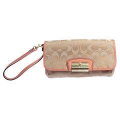 Coach pochette caractéristique en toile et cuir beige/orange