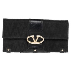 Cartera continental de lona y piel negra Valentino