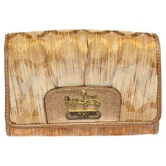 Coach Portefeuille compact caractéristique Op Art en toile et cuir couleur or