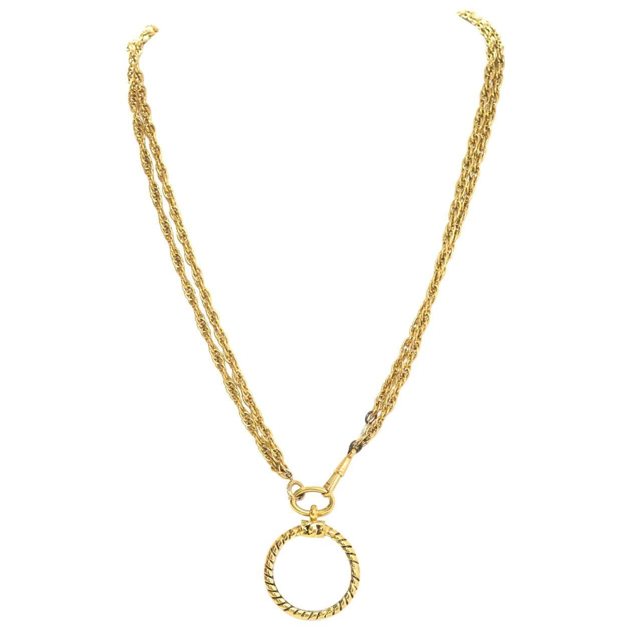 Chanel Vintage Gold Double Chain Magnifying Glass Pendant Necklace
Made In: France
Year of Production: 1982
Color: Goldtone
Materials: Metal and glass
Closure: Jump ring closure
Stamp: Chanel CC 1982 Made in France
Overall Condition: Very good