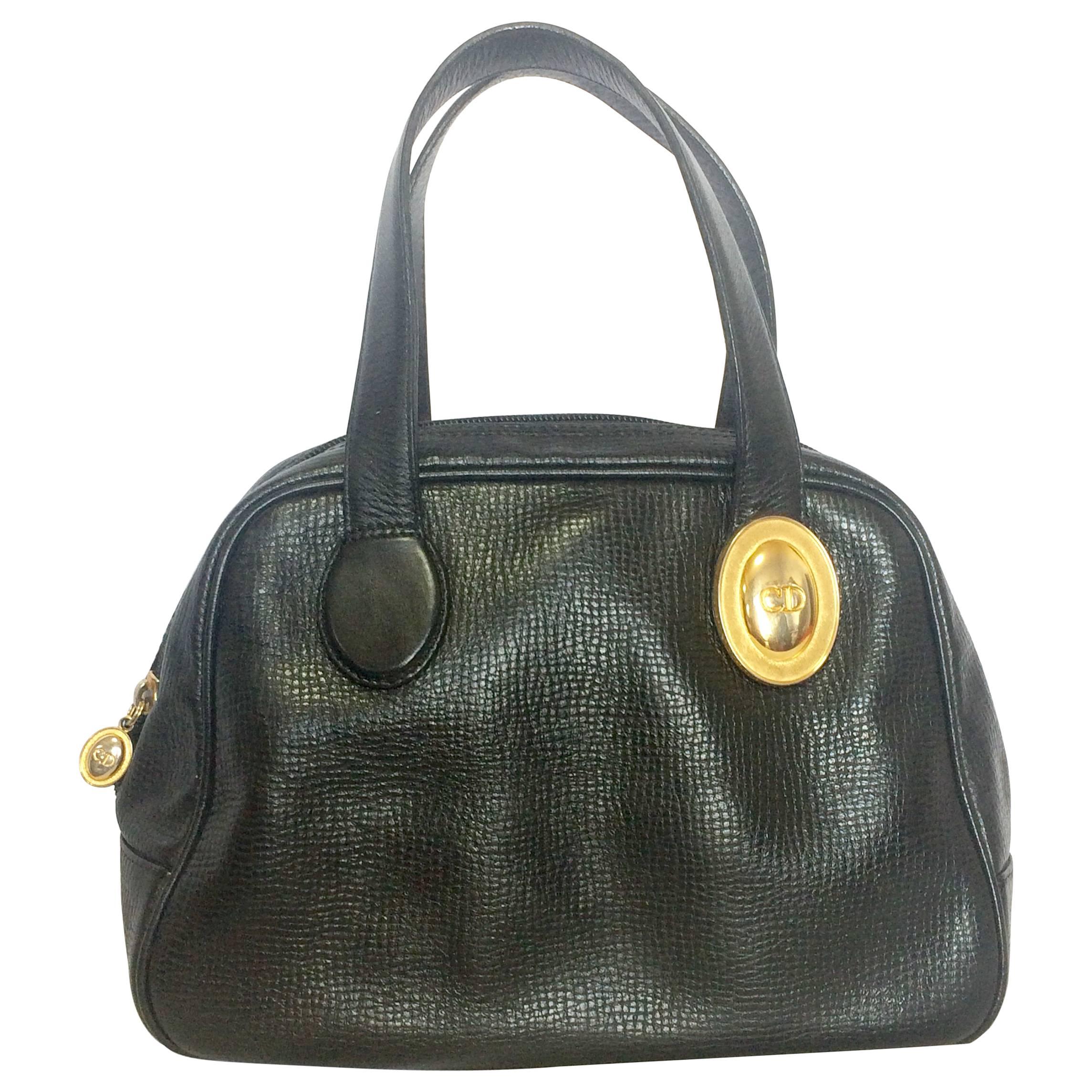 Vintage Christian Dior black leather mini bolide style handbag with logo motif.