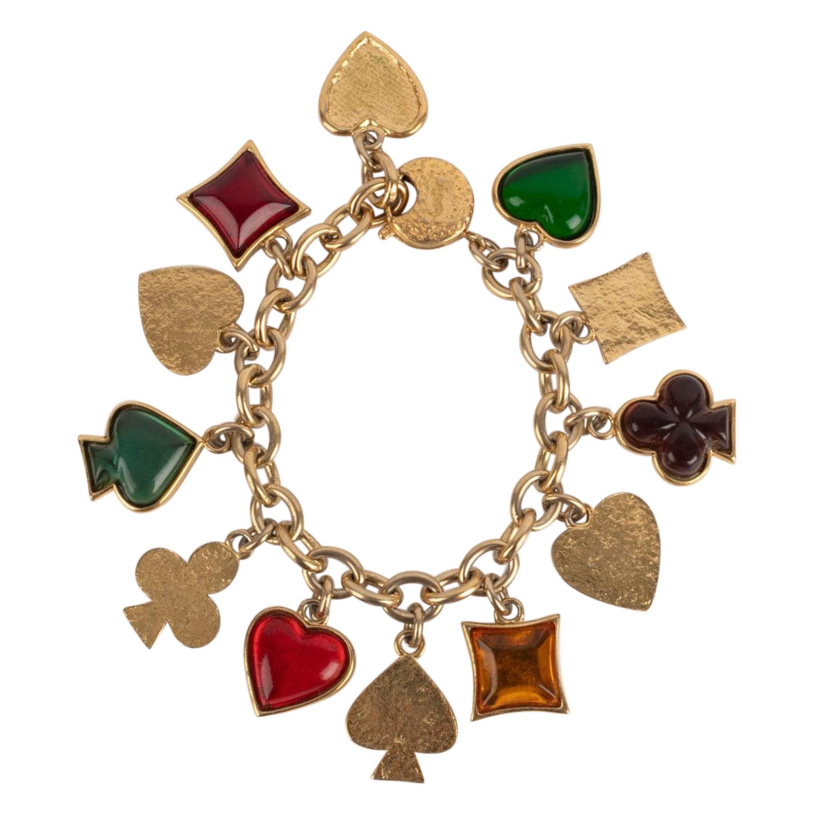 Bracciale con charme in metallo dorato Yves Saint Laurent in vendita
