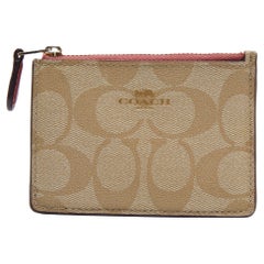 Porte-cartes zippé en toile enduite et cuir beige/rose Signature de Coach