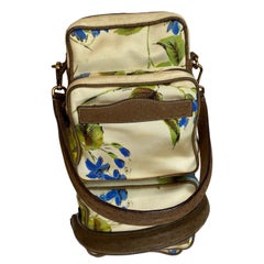Vintage Prada silk bag with floral pattern and leather details.