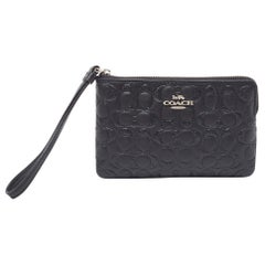 Pochette en cuir gaufré et paillettes Signature de Coach (noir)
