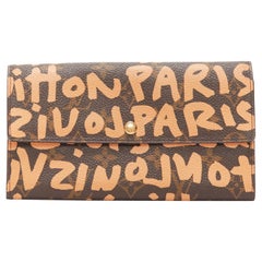 LOUIS VUITTON Portefeuille long monogramme orange graffiti marron Stephen Sprouse