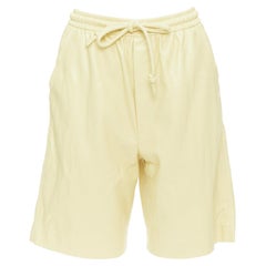 NANUSHKA  Munira Okobor butter yellow vegan leather drawstring bermuda shorts XS