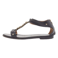 Salvatore Ferragamo Sandales plates en cuir noir avec détails en T Chan Taille 39.5