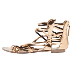 Giuseppe Zanotti Sandali piatti in pelle oro con polsino alla caviglia misura 38,5