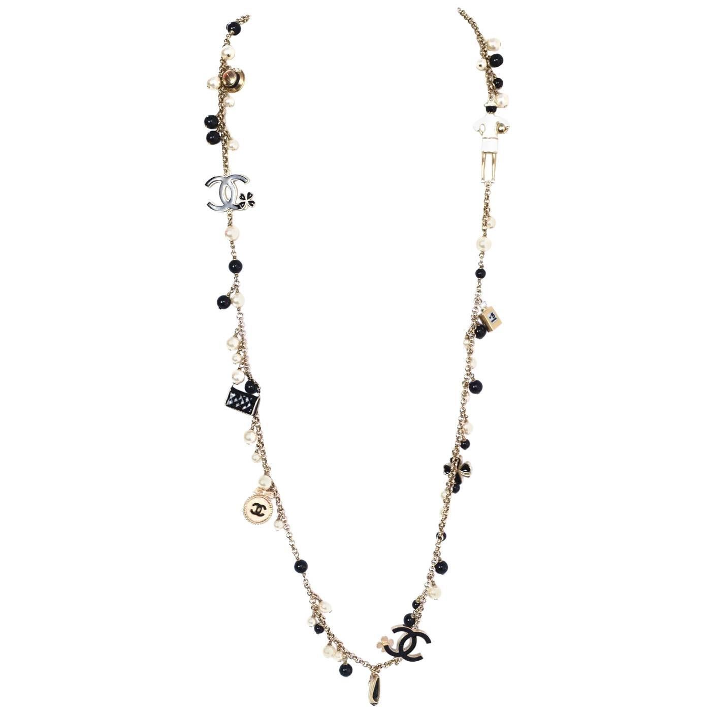 Chanel Pearl and Black Beaded and Iconic Charm Necklace For Sale at ...