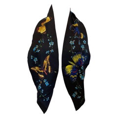 Lanvin bandolier in blue with flower and butterfly print.