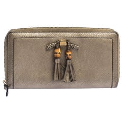 Gucci Gold Leather Bamboo Tassel Bow Zip Around Wallet
