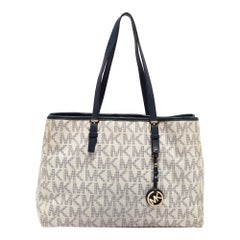 Michael Kors Marineblau/Weiß Signature Jet Set Tote aus beschichtetem Canvas und Leder