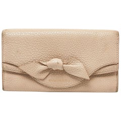 Burberry Cartera Continental de Piel Beige con Lazo