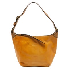 Mini Hobo Logo Coach de charol amarillo