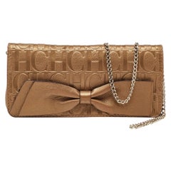 CH Carolina Herrera Gold Monogram Leather Bow Chain Clutch
