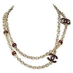 Chanel Necklace in gold metal and brown CC