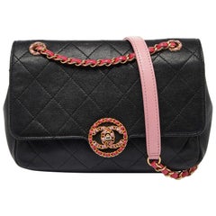 Chanel - Sac à bandoulière en cuir matelassé noir/rose avec logo CC Chain