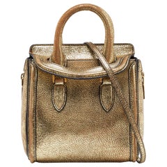 Alexander McQueen Mini bolso heroína de piel dorada