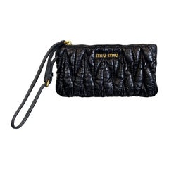 Black Miu Miu mini clutch bag