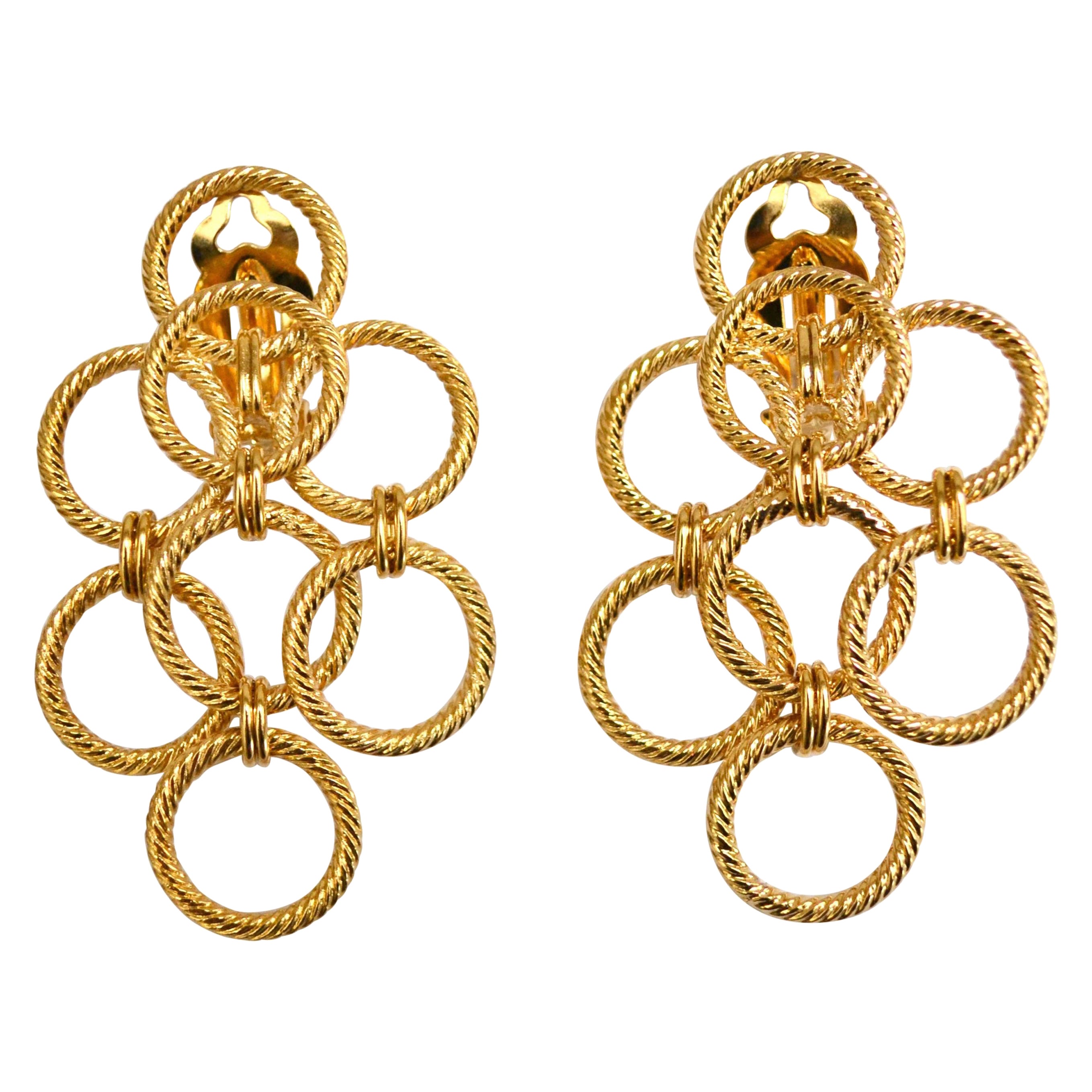 Orecchini a tripla clip in bronzo dorato 24 carati in vendita