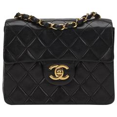1980s Chanel Black Quilted Lambskin Vintage Mini Flap Bag