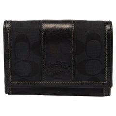 Portefeuille continental en toile et cuir Signature noire de Coach