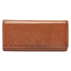 CH Carolina Herrera Brown Monogram Embossed Leather Trifold Continental Wallet