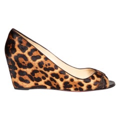 Christian Louboutin Chausssures compensées en poil de poney imprimé léopard taille IT 40