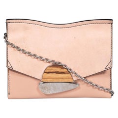 Pochette Proenza Schouler a forma di ricciolo in pelle rosa
