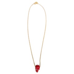 Alexander McQueen - Collier à chaîne en or avec tête de mort rouge