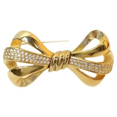 Broche de lazo dorado Swarovski vintage