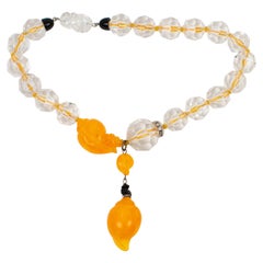 Angela Caputi, collier ras du cou en résine orange avec perles facettées