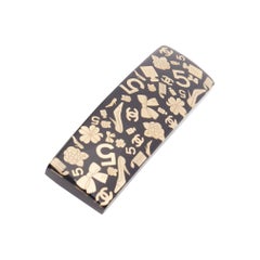 CHANEL 2024 oro CC 5 arco trébol resina negro pelo barette