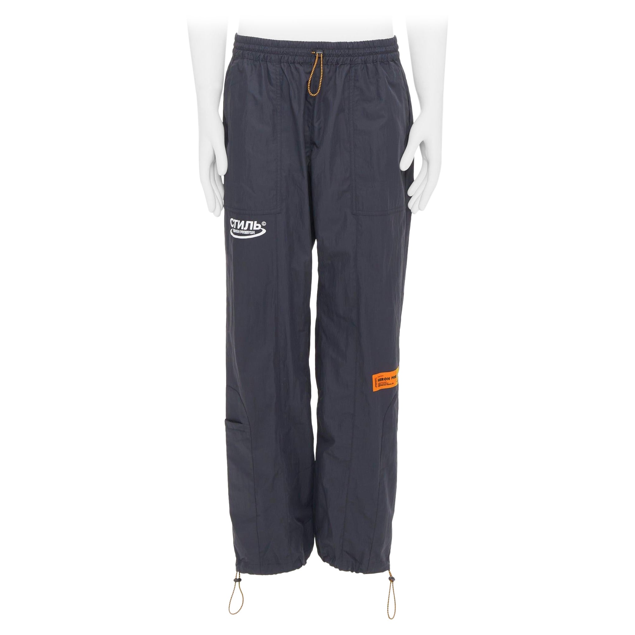 HERON PRESTON negro naranja nylon patchwork logo cordón joggers M
