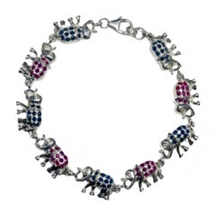 Pulsera única de zafiro azul y rubí con tachuelas de elefante en plata de ley 925