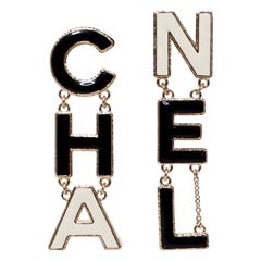 Chanel 2022 "CHA-NEL" Logo Gold-Tone Black & White Metal Enamel Drop Earrings