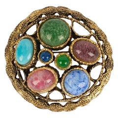 Broche Christian Dior de metal dorado y pasta de vidrio, 1970