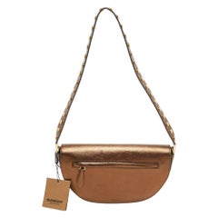 Burberry - Petit sac à bandoulière en cuir bronze clouté Olympia