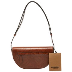 Burberry - Petit sac à bandoulière Olympia en cuir gaufré marron TB