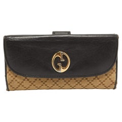 Cartera continental 1973 de lona y piel con diamantes beige/negro de Gucci